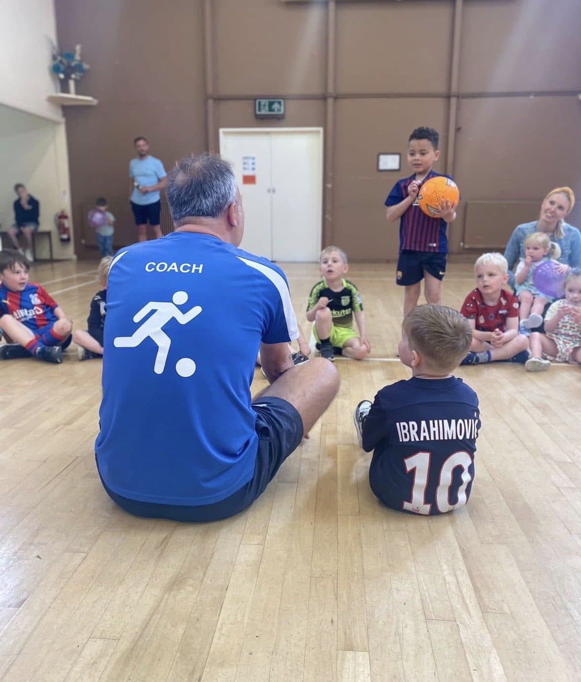 Coach leading an indoor midweek Strikers session